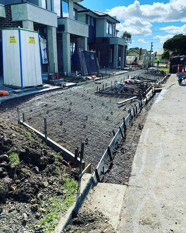Reinforcement and formwork set out for driveways in front of new townhouses