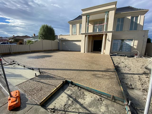 New exposed aggregate driveway with formwork still in place along the side