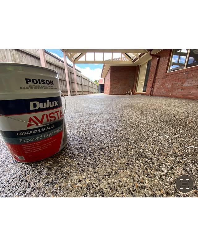Exposed aggregate patio with a tin of Dulux Avista concrete sealer