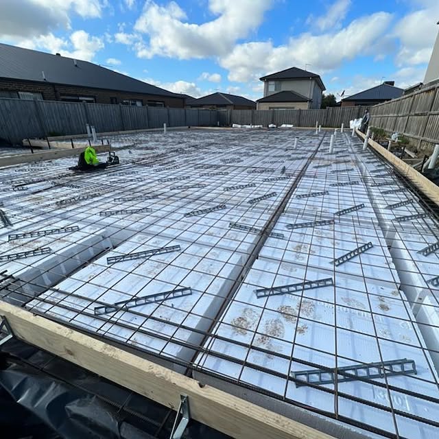 Steel mesh laid over foam waffle pods ready for a house slab pour